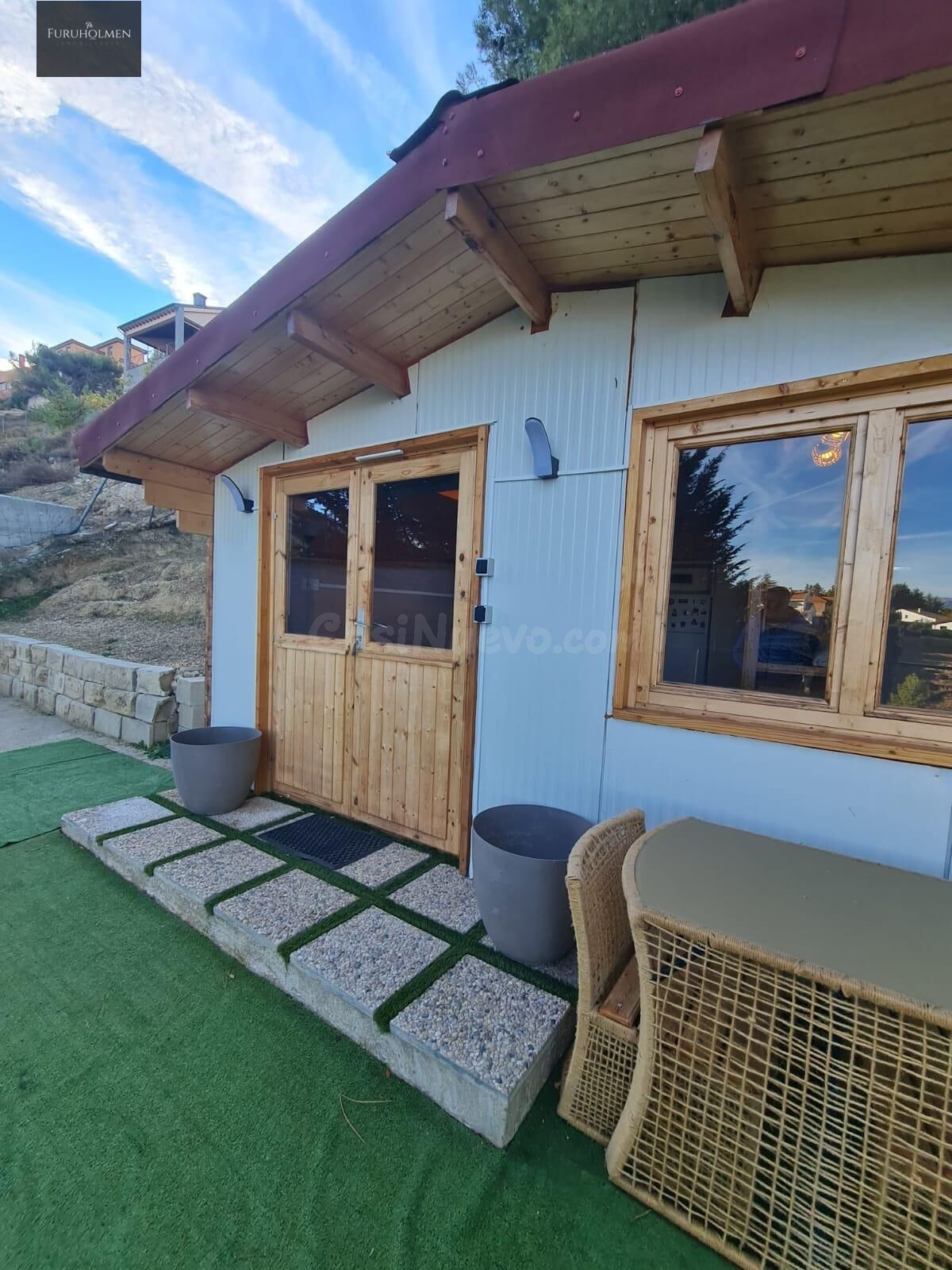Parcela con una casita de madera en Cumbres Verdes.