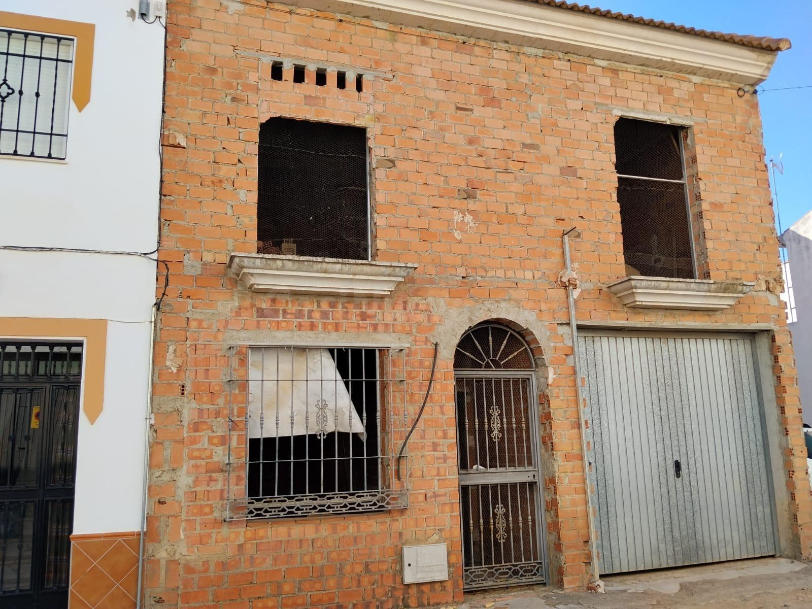A. Casa en construcción en La Carlota