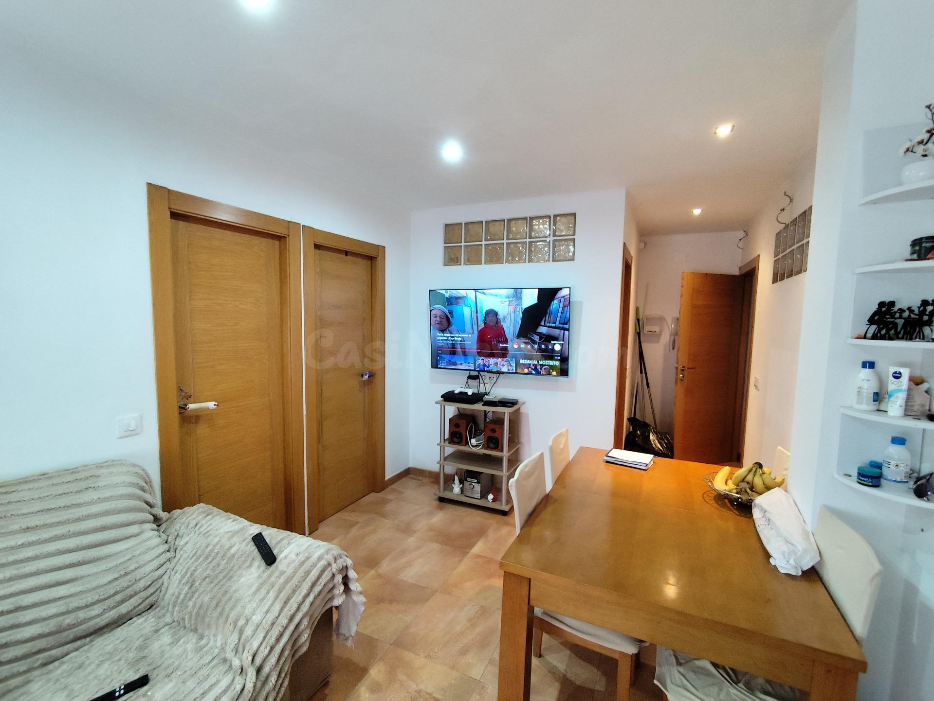 VIVIENDA EN DOS PLANTAS: ARRIBA VIVIENDA Y ABAJO PLAZA DE GARAJE Y LOCAL COMERCIAL, ACONDICIONADO.