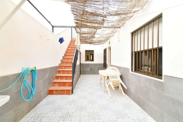 VIVIENDA DE PLANTA BAJA CON SOLARIUM Y COCHERA — 13