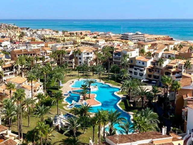 Maravilloso apartamento (aprox. 94 m2 - 1ª planta) en la popular Aldea del Mar con gran zona de piscina. Amplio balcón al sureste y a solo 400 m de la Playa de los Locos. — 36