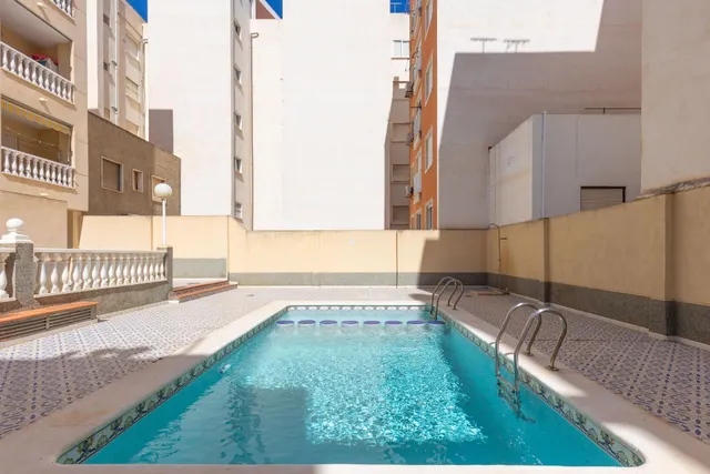 Acogedor piso en planta baja con piscina comunitaria — 26