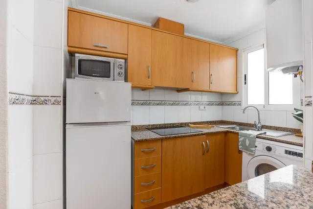 APARTAMENTO DE DOS DORMITORIOS CON VISTAS A LA LAGUNA ROSA Y CON PISCINA COMUNITARIA — 15