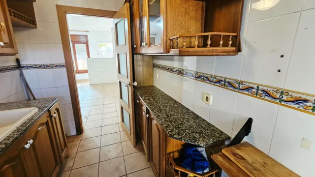 CASA PLANTA BAJA CON 2 VECINOS CON JARDÍN — 12