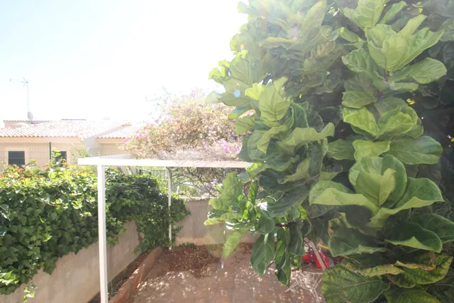 PLANTA BAJA CON JARDIN , GARAJES, TRASTERO Y PISICINA COMUNITARIA JUNTO A MARIVENT — 13