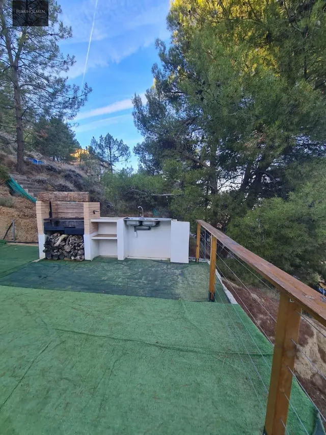 Parcela con una casita de madera en Cumbres Verdes. — 20
