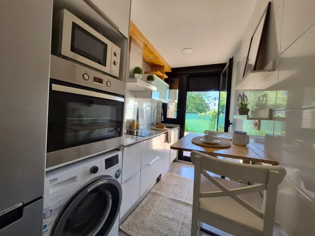 Se pone a la venta bajo con terraza y jardin  de dos habitaciones , garaje y piscina comunitaria — 7