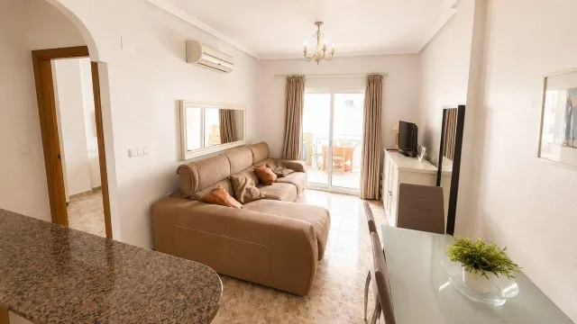 Apartamento turístico en primera línea de mar con piscina, garaje y solárium panorámico — 10