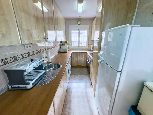 Encantador adosado de 2 plantas en Nueva Torrevieja — 2 dormitorios, 2 baños, gran patio y piscina comunitaria — 16