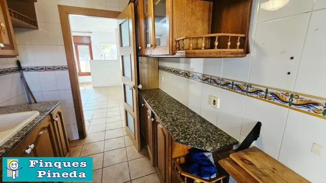 CASA PLANTA BAJA CON 2 VECINOS CON JARDÍN — 11