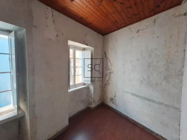 Casa adosada en el centro de Cariño. — 12