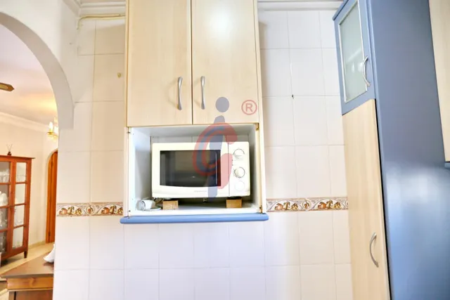 Planta baja en venta en el centro de Guardamar del Segura con gran terraza privada y piscina comunitaria — 16
