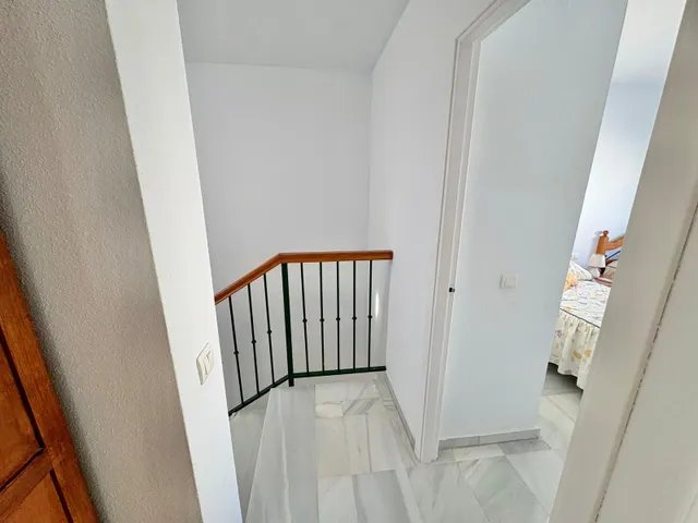 Casa adosada con dos patios privados y piscina comunitaria en Caleta de Vélez — 29