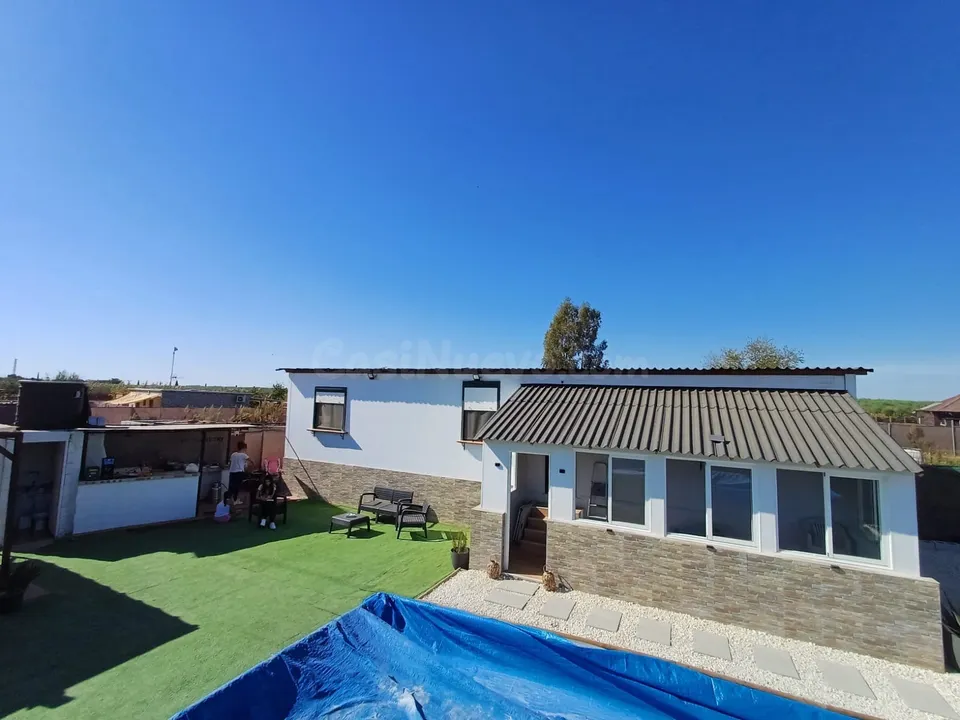 Parcela con casa