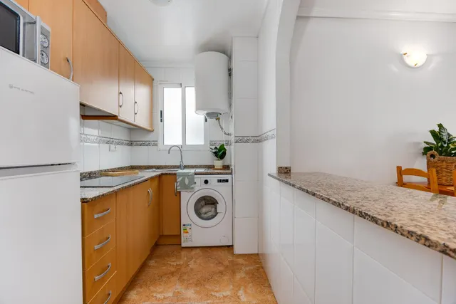 APARTAMENTO DE DOS DORMITORIOS CON VISTAS A LA LAGUNA ROSA Y CON PISCINA COMUNITARIA — 24
