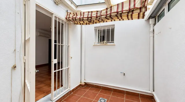 VIVIENDA ADOSADA EN CAMPOSOTO CON PATIOS Y  AZOTEA — 12