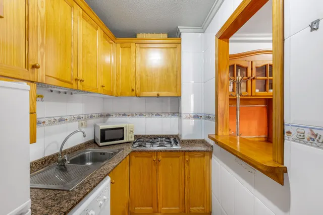 Acogedor piso en planta baja con piscina comunitaria — 10