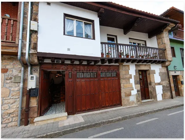 CASA CON DOS APARTAMENTOS Y GRAN POTENCIAL EN ARENAS DE IGUÑ - foto 2