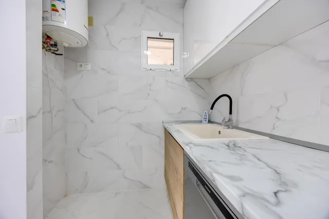 Planta baja de dos dormitorios, totalmente reformada y con piscina comunitaria — 15