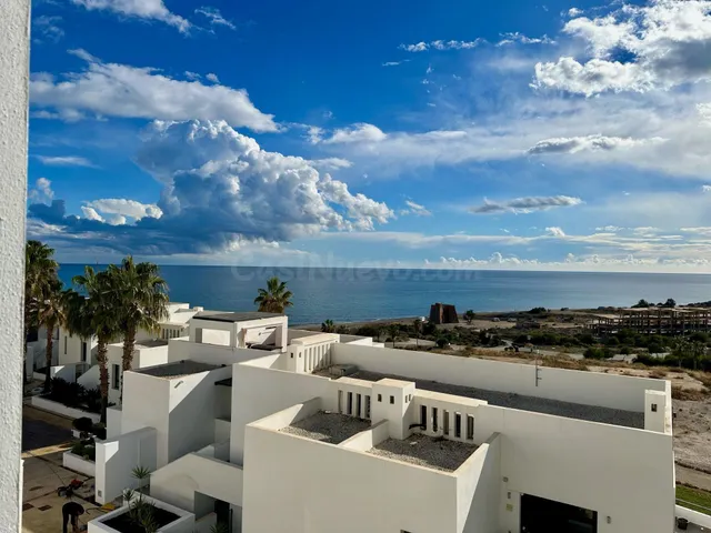 Atico dos dormitorios, terraza vistas al mar y parking en Mo