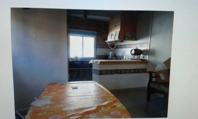 TERRENO URBANO CON CASA DE MADERA Y CASA DE CEMENTO. — 2