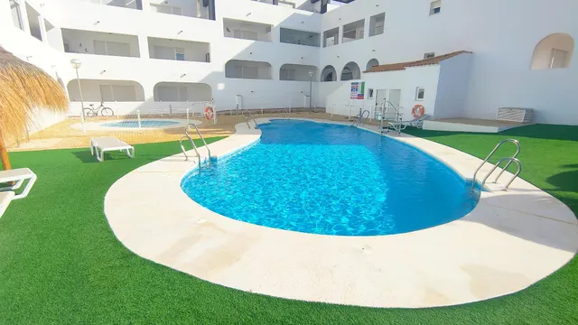 Apartamento de 1 dormitorio con terraza y piscina en Urbanización Milenio III en San Juan de los Terreros — 28