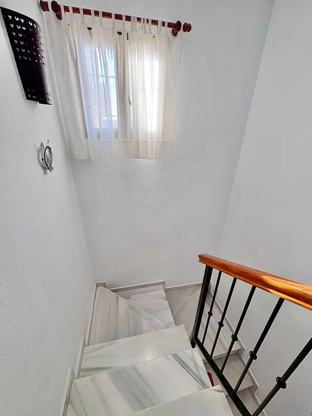 Casa adosada con dos patios privados y piscina comunitaria en Caleta de Vélez — 25